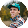 Smiling author headshot with blurred outdoor background