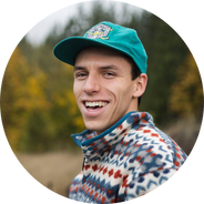 Smiling author headshot with blurred outdoor background