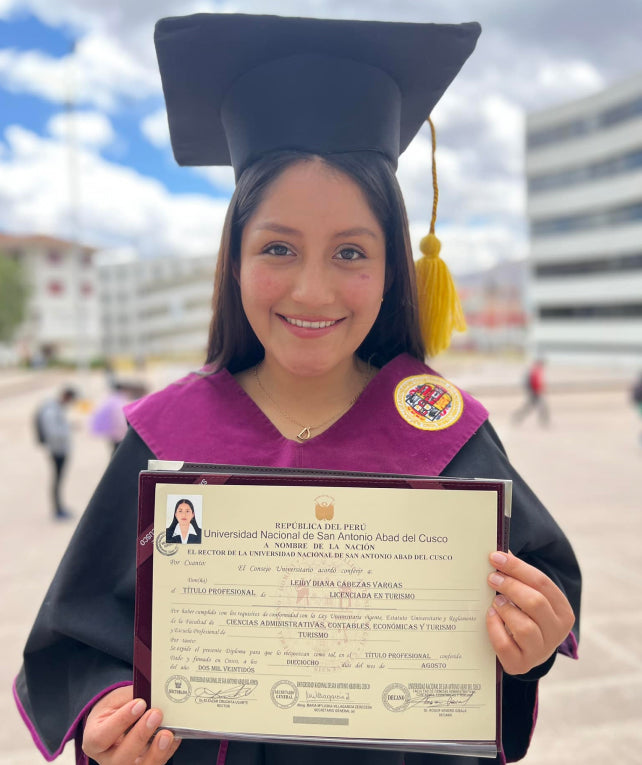 Paka scholar Lady Diana holding her degree diploma
