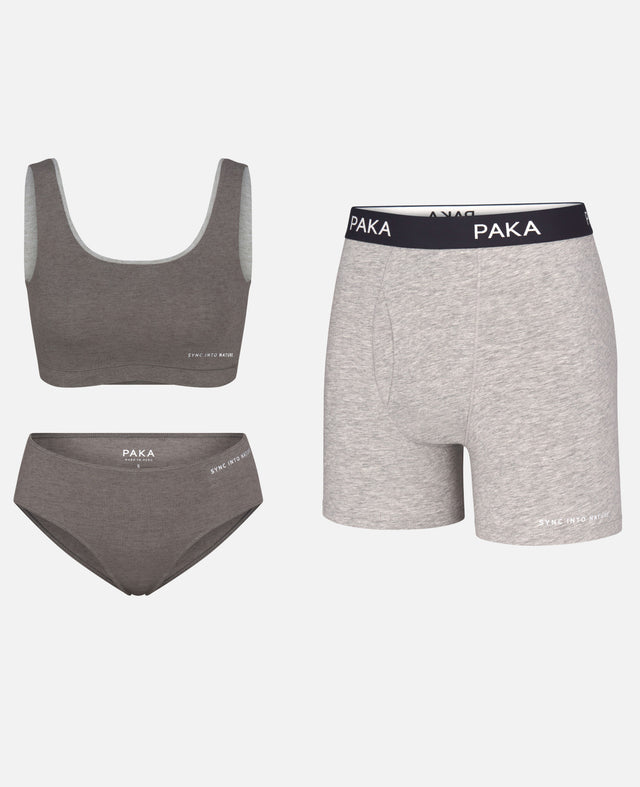 Front flat-lay of alpaca underwear: women’s bralette and brief plus men’s boxer in heather gray, soft knit with elastic band