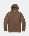 Front flat-lay of The Hoodie alpaca hoodie in Cafe Heather with V-stitch neck and logo patch on light gray