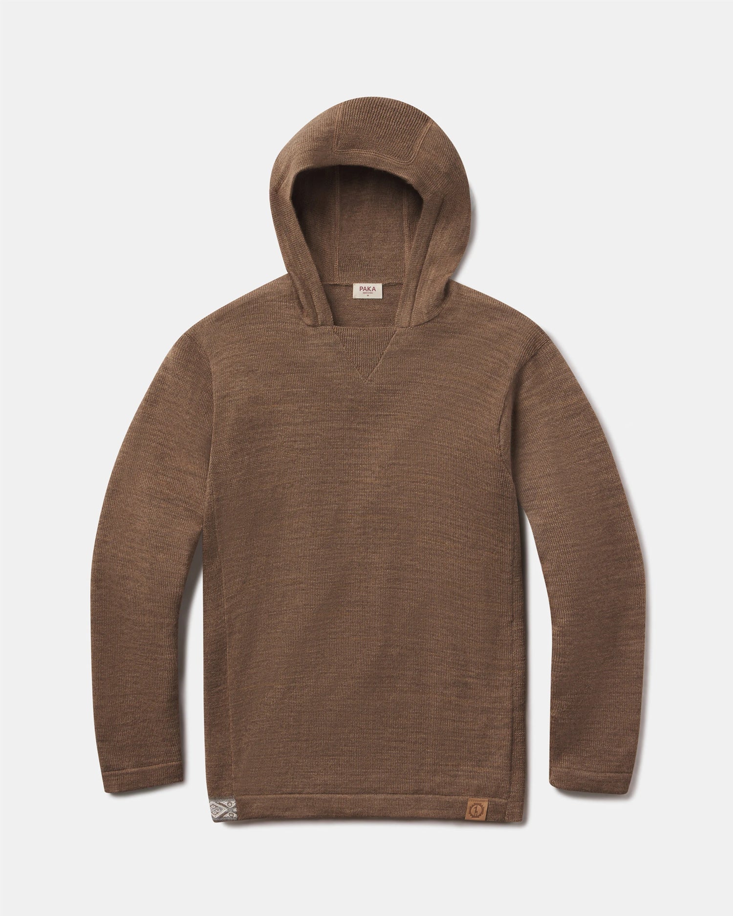Front flat-lay of The Hoodie alpaca hoodie in Cafe Heather with V-stitch neck and logo patch on light gray