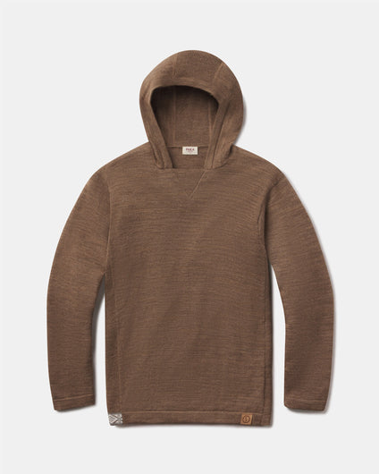 Front flat-lay of The Hoodie alpaca hoodie in Cafe Heather with V-stitch neck and logo patch on light gray