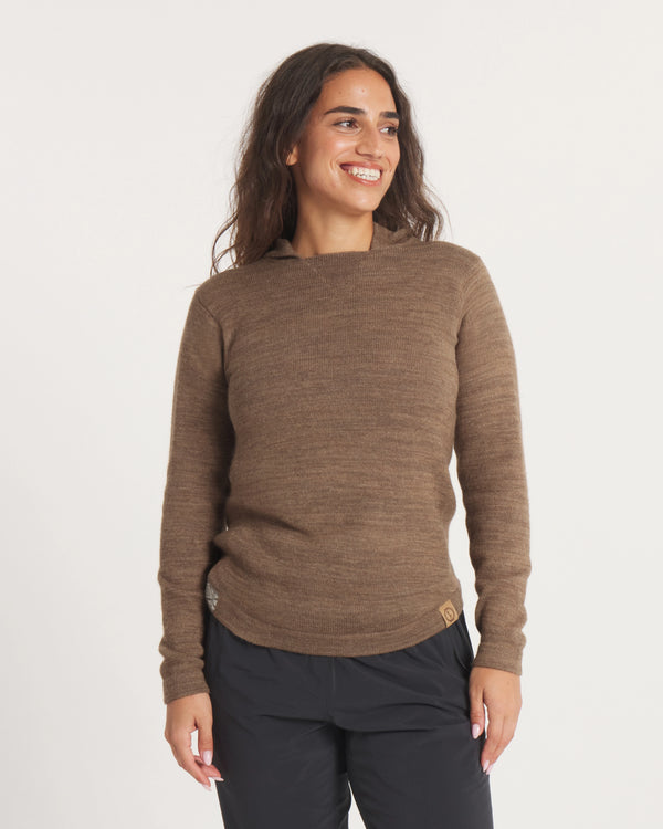 Front view of alpaca wool hoodie in Cafe Heather on model, relaxed fit with long sleeves and hood against light background