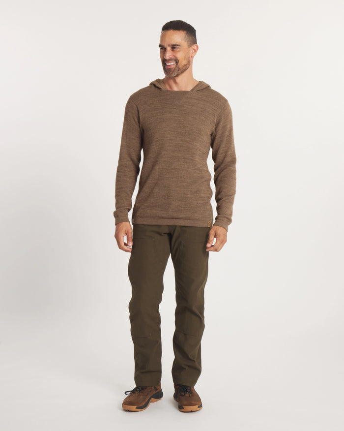 Front view of The Hoodie in cafe heather on a model, showing hood, knit texture, long sleeves and relaxed unisex fit