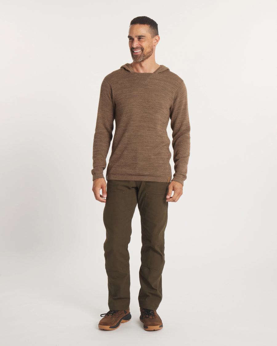 Front view of The Hoodie in cafe heather on a model, showing hood, knit texture, long sleeves and relaxed unisex fit