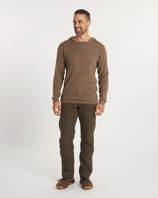 Front view of The Hoodie in cafe heather on a model, showing hood, knit texture, long sleeves and relaxed unisex fit