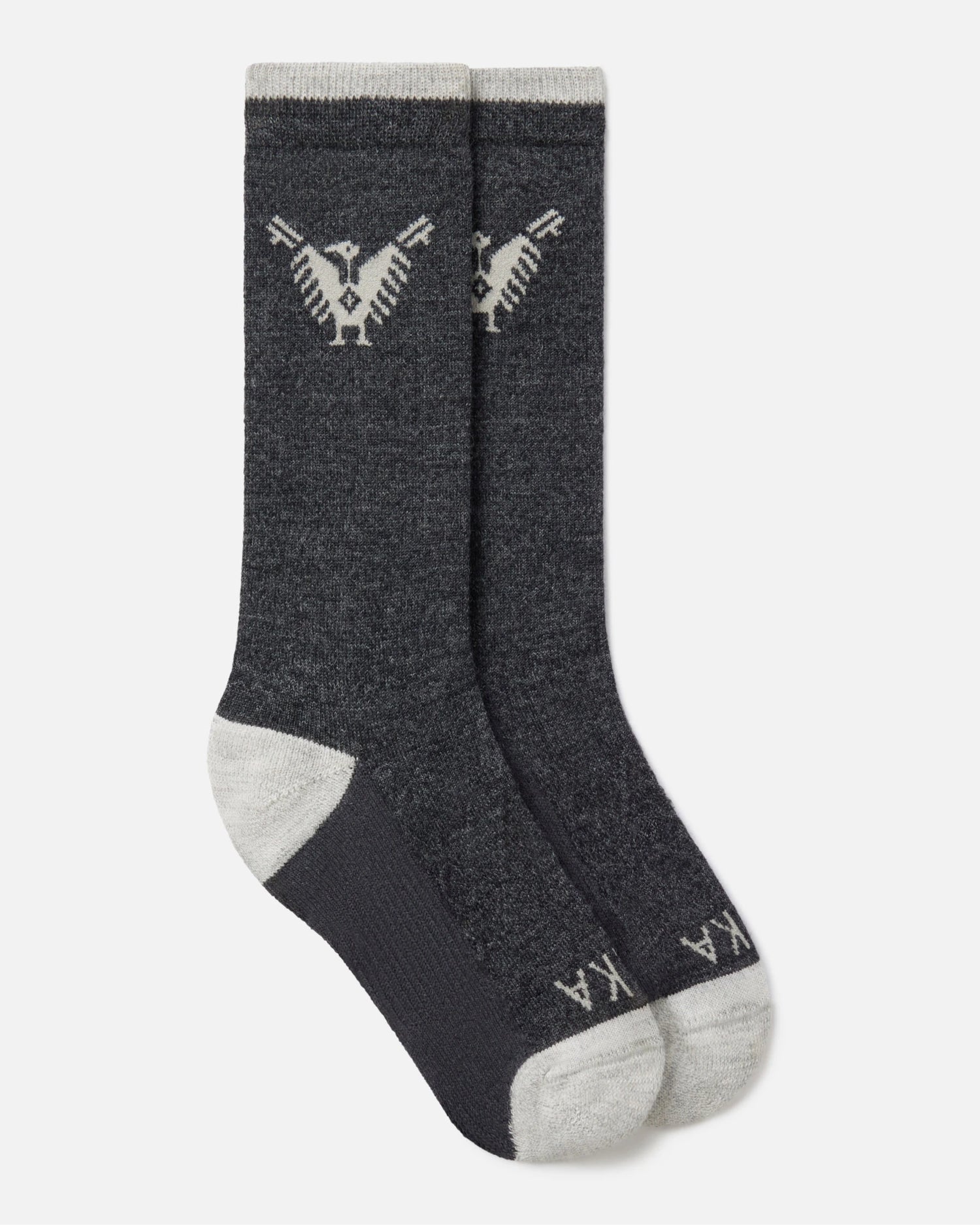 Top-down view of charcoal Condór crew socks with Inca condor motif and contrast gray heel and toe on white background
