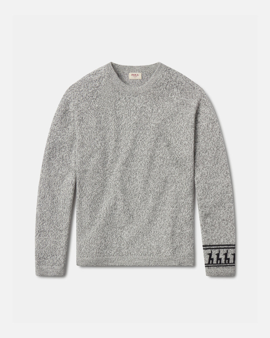 Front flat lay of The Costa alpaca sweater showcasing textured knit and patterned cuff in light grey on a light background