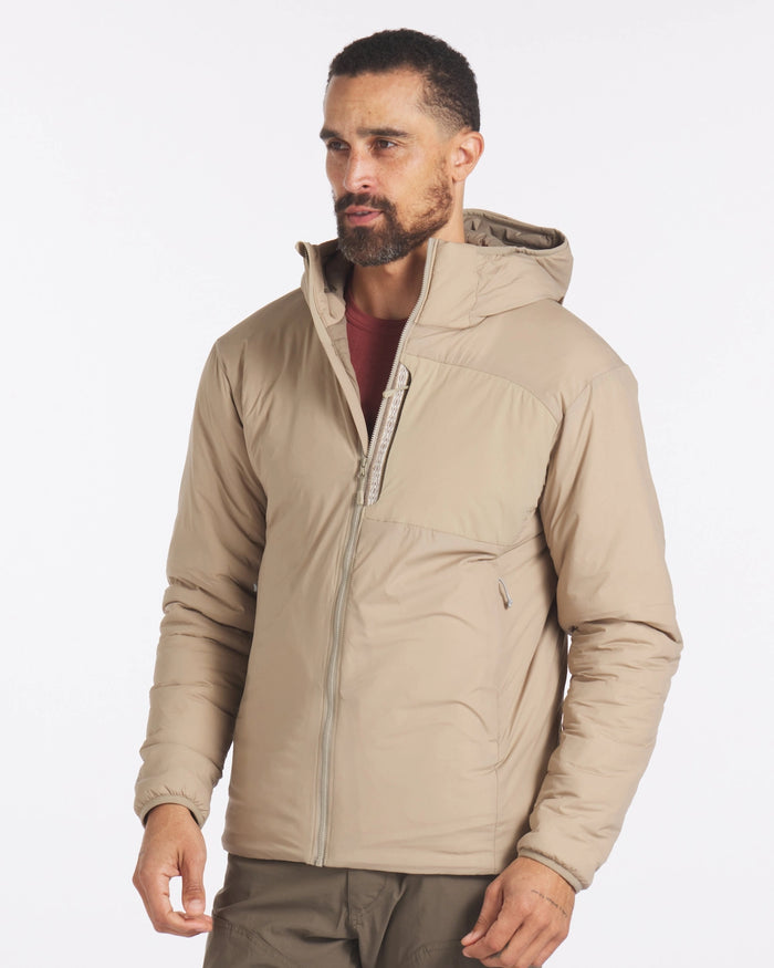 Model Wearing Apu Desert / Tan Men's Packable Lightweight Puffer Jacket with Sustainable PAKAFILL® Insulation – PAKA Apparel