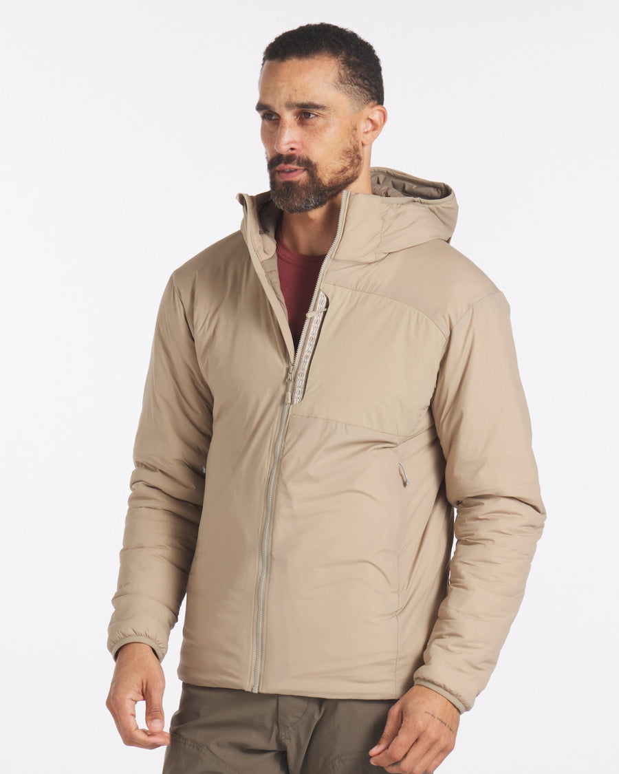 Model Wearing Apu Desert / Tan Men's Packable Lightweight Puffer Jacket with Sustainable PAKAFILL® Insulation – PAKA Apparel