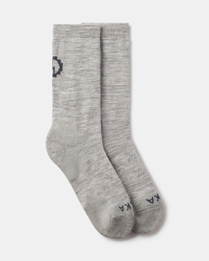 Top-down view of Essential Crew Socks in light gray showcasing mid-calf length and alpaca knit texture on white background