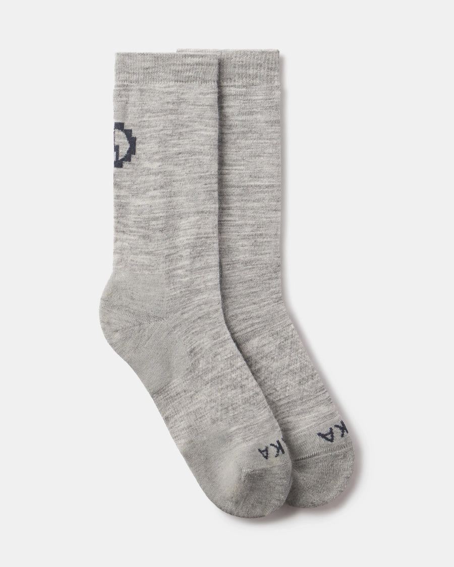 Top-down view of Essential Crew Socks in light gray showcasing mid-calf length and alpaca knit texture on white background