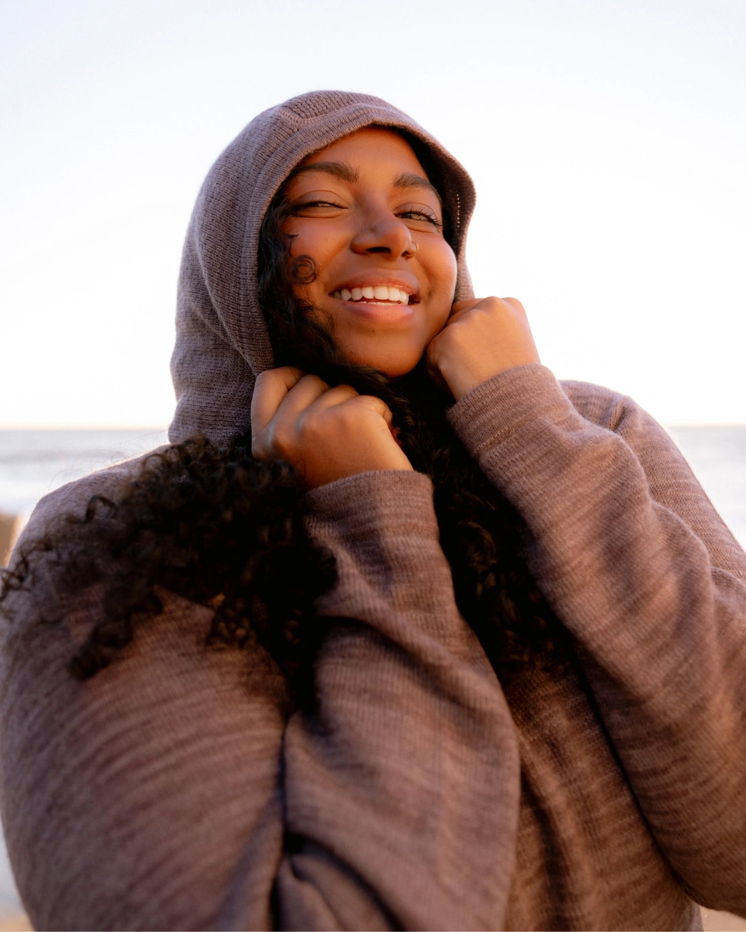 Woman Named Meghna posing in The Hoodie Flint Sweater Hoodie – PAKA Apparel