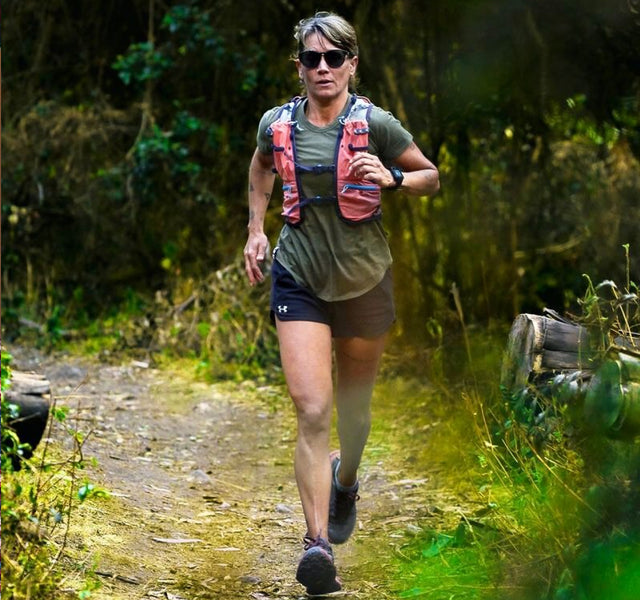 Ankle alpaca running socks on active woman running on a trail 