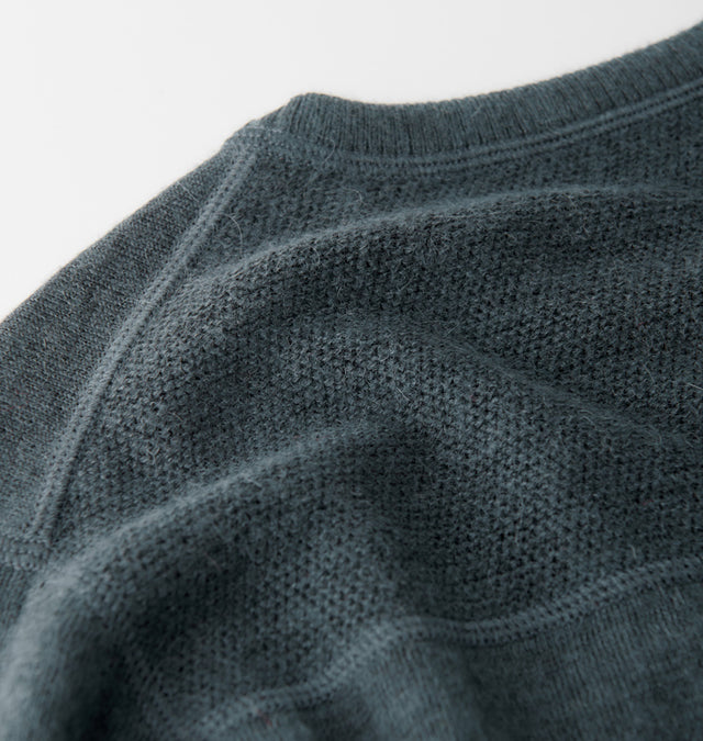 Close-up of Ultralight Crew showing waffle-knit ventilation mesh and neckline seam in dark teal on white background