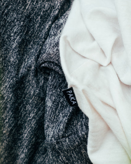 Close Up of Natural Alpaca Fiber Shirts with a Tag Reading "PAKA" – PAKA Apparel