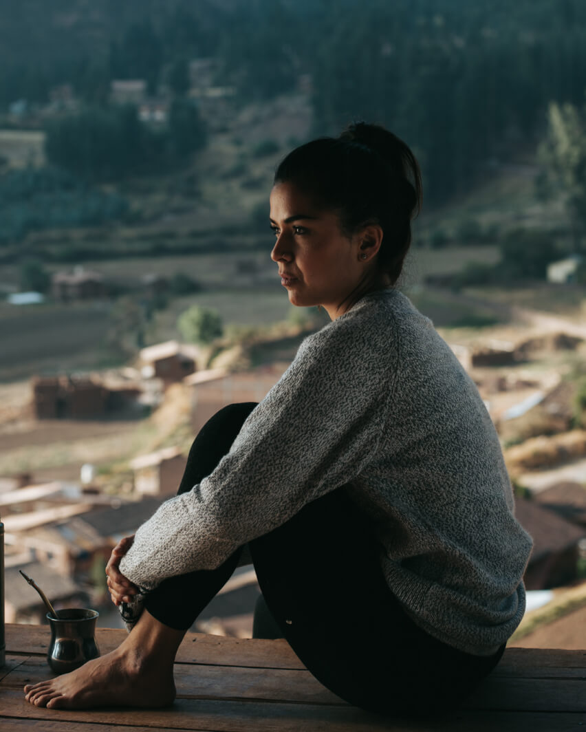 a seated lady wearing The Costa