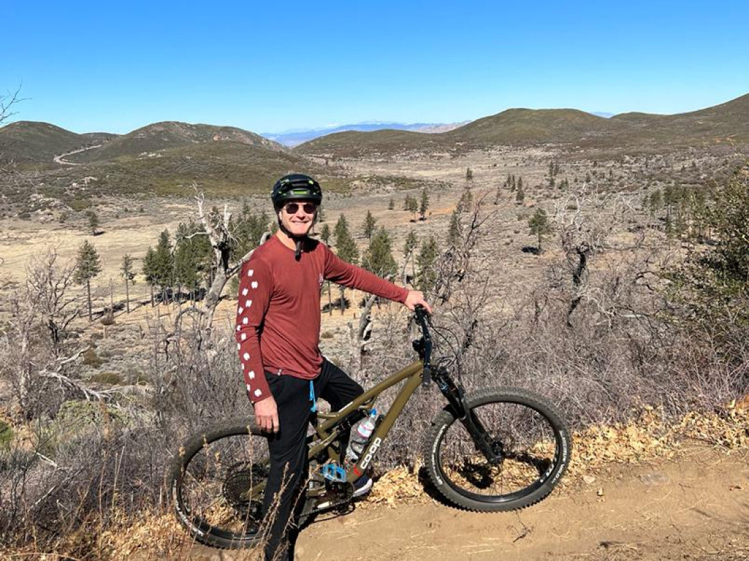 A man riding a bike on his clay Sebastian baselayer