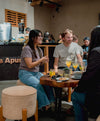 Customers seated at café inside PAKA flagship store in Cusco with alpaca clothing displays
