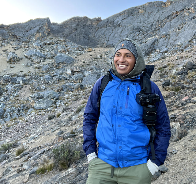 Travel photographer Noah, standing near the base of Ausangate smiling. 