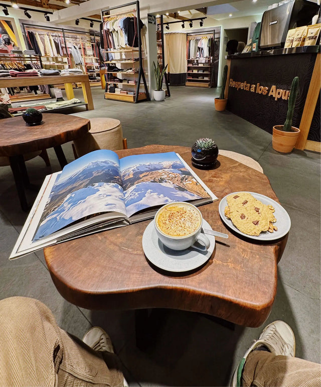 Table display with ceramic bowls and magazines inside Paka flagship store in Cusco
