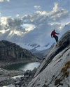 Man climbing mountain with a rope