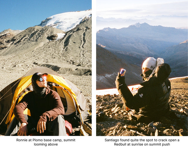 Two climbers resting on a sunlit alpine slope with rocky mountains in the background