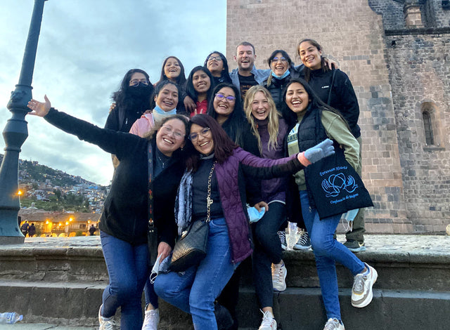 Our Paka team and our scholars smiling in Cusco