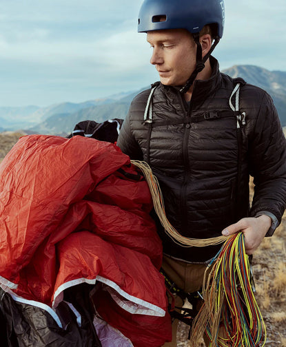 Front view of Mayu ultralight jacket showcasing PAKAFILL insulation and lightweight, packable design on a model outdoors