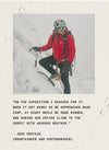 Person in a red jacket seated on a rocky mountain slope with a quote overlay reading ‘In the mountains I realize I’m...’