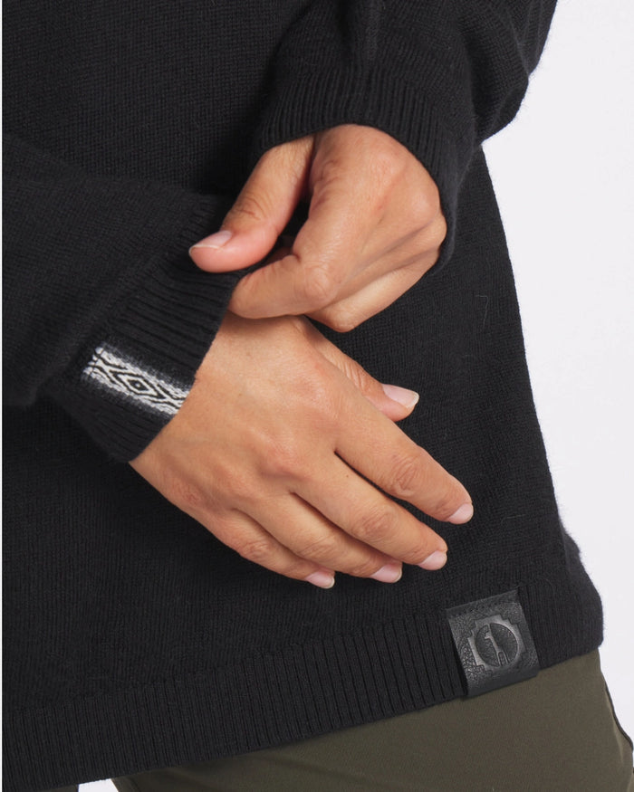 Close up of Lightweight Crew midsection showcasing Inca ID woven cuff detail and leather logo patch against white background