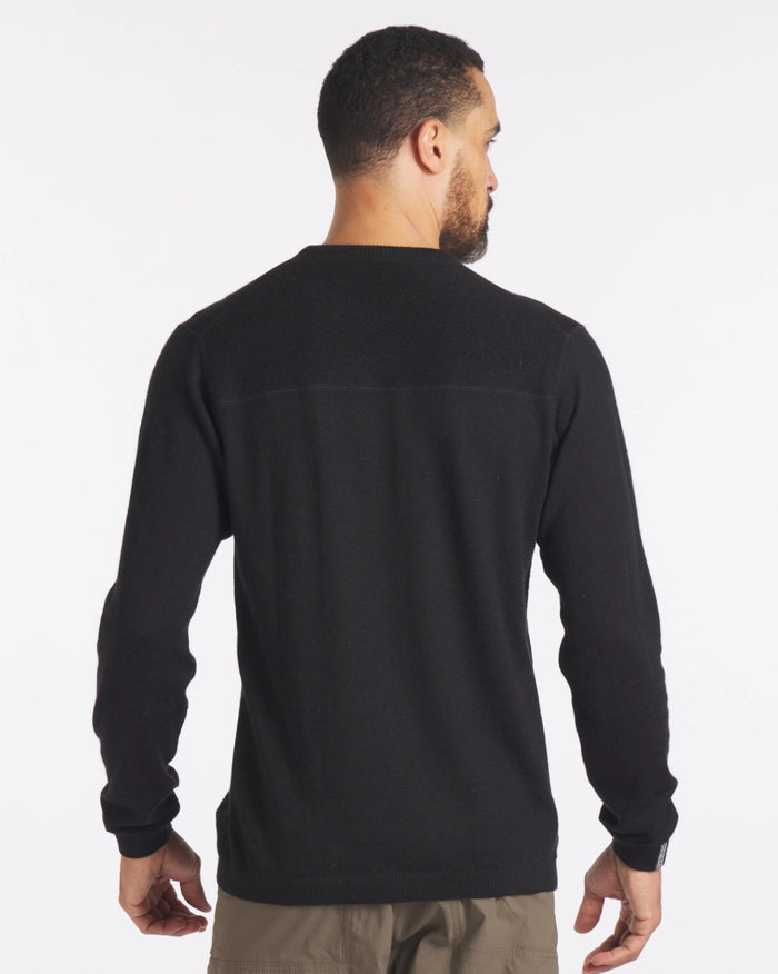 Back view of The Lightweight Crew in black on a male model showcasing textured upper yoke and relaxed fit against a white background
