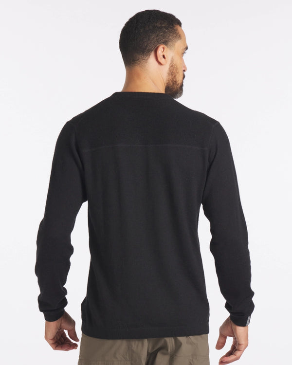 Back view of The Lightweight Crew in black on a male model showcasing textured upper yoke and relaxed fit against a white background