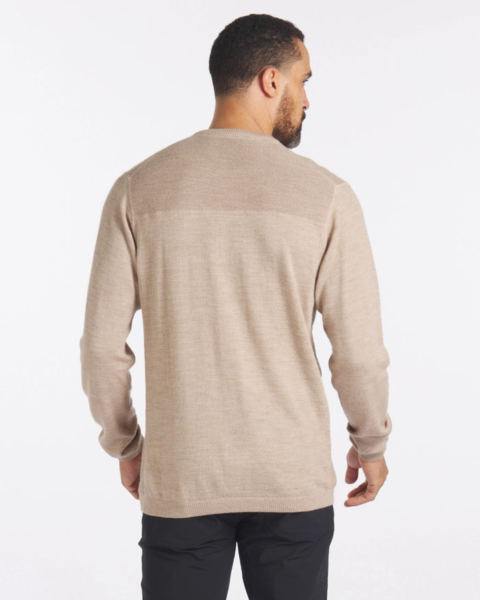 Back view of The Lightweight Crew in tan showcasing textured knit yoke and relaxed fit on a male model with white background