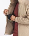 Apu Lightweight Puffer, three-quarter view showing open front and interior zip pocket, model in burgundy on white background