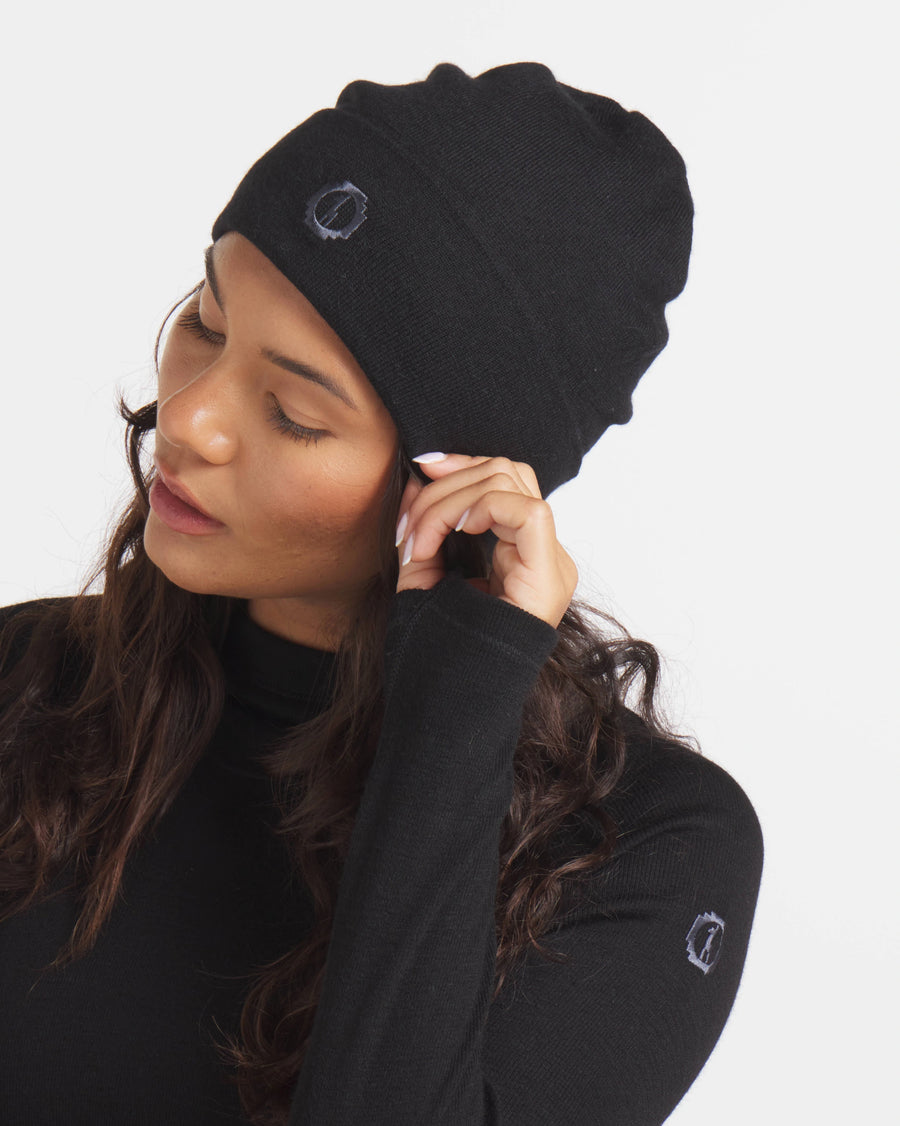 Woman Adjusting Black Rib-Knit Cuffed Alpaca Wool Beanie – PAKA Apparel