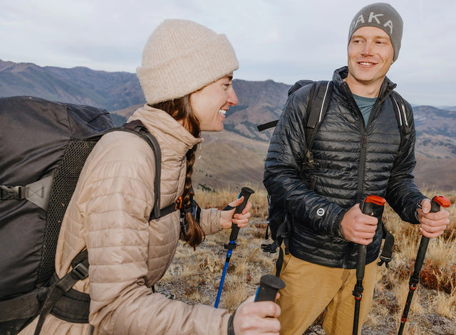 Front view of Mayu ultralight PAKAFILL jacket showcasing hood and quilted insulation with neutral background