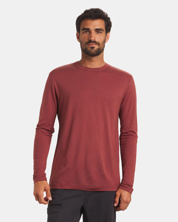 Front view of Men’s Aire long-sleeve alpaca shirt in clay on model showing crew neck and regular fit with light gray background