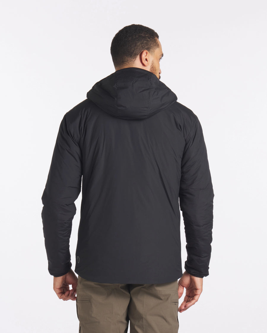 Backside of Man in Black Apu Lightweight Sustainable Puffer Jacket – PAKA Apparel