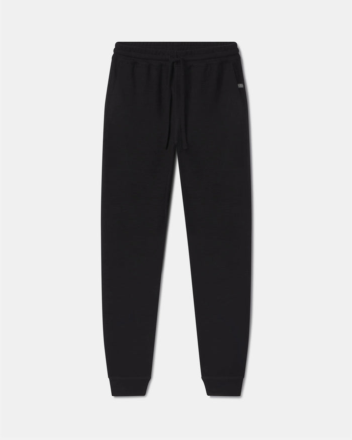 Front view of Men’s Breathe Jogger in black showing drawstring waistband and tapered cuffs on light gray background