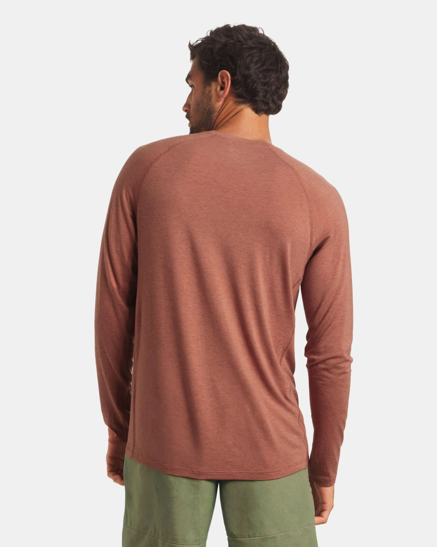Back view of Men’s Sol Crew alpaca long-sleeve UPF sun shirt in cinnamon, showing raglan sleeves and smooth knit on light gray background