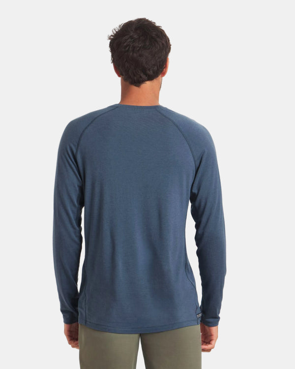 Rear view of Men’s Sol Crew long-sleeve navy alpaca sun shirt showing raglan sleeves and regular fit on light gray background