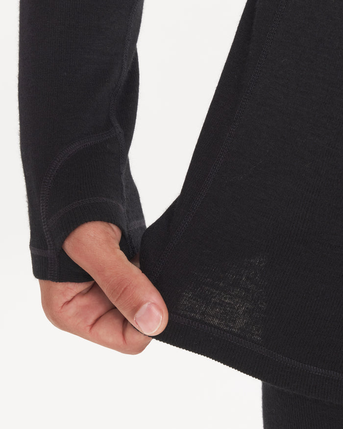 Hand Tugging on Waist of Men's Alpaca Thermal Crew Baselayer Shirt in Black – PAKA Apparel