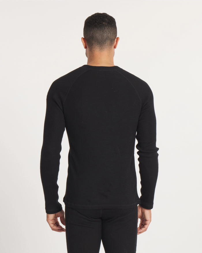 Back view of Men’s Thermal Crew alpaca baselayer showing raglan sleeves and slim, hip-length fit on model against a light studio background