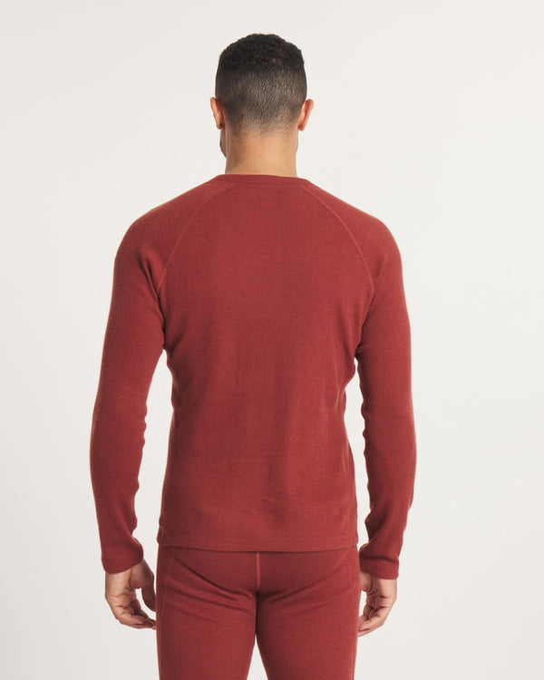 Back view of Men’s Thermal Crew alpaca baselayer in clay showing raglan shoulder seams and fitted long sleeves on white