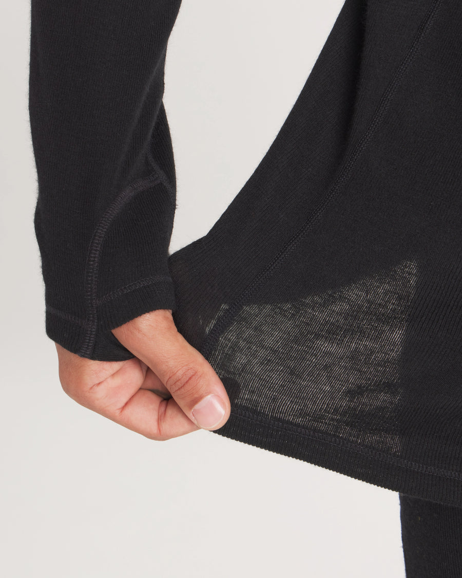 Close-up of Men’s Thermal Hoodie hem and sleeve showcasing fabric stretch and sheer knit with thumbhole on light background