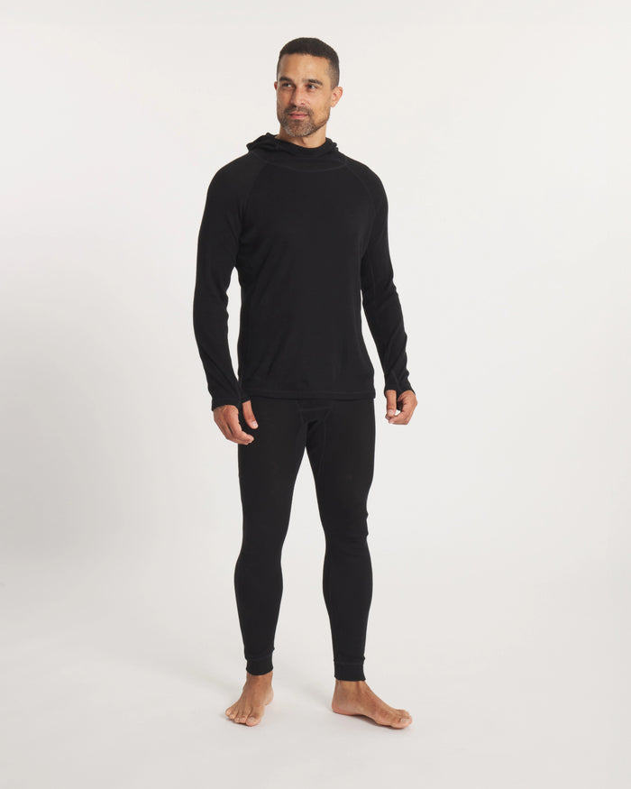 Front view of men’s Thermal Hoodie in black on model, slim fit with ergonomic hood, raglan sleeves, and thumbhole cuffs