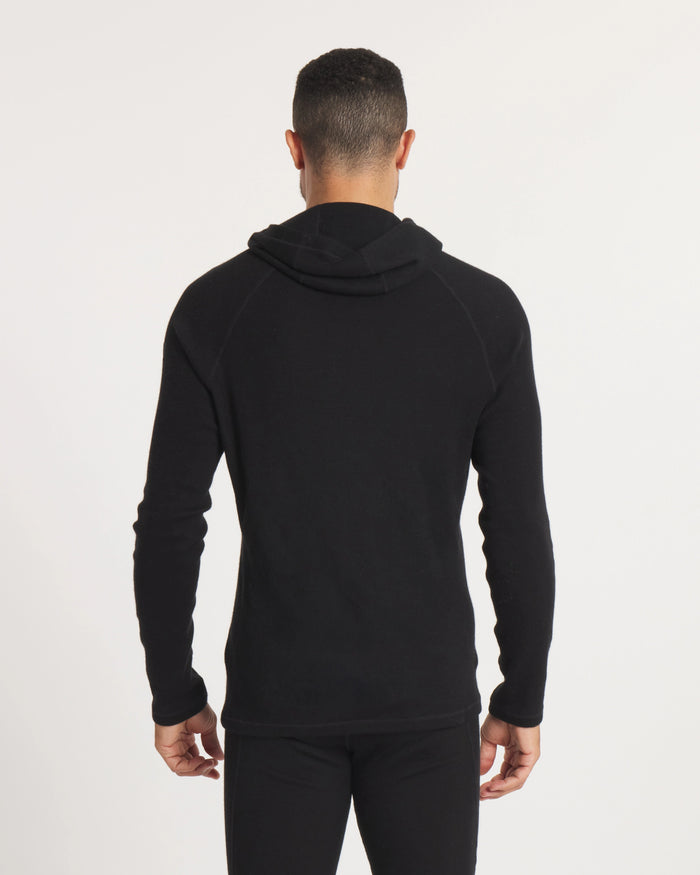 Back view of Men’s Thermal Hoodie in black showing slim fit, raglan sleeves, ergonomic hood folded down on white background