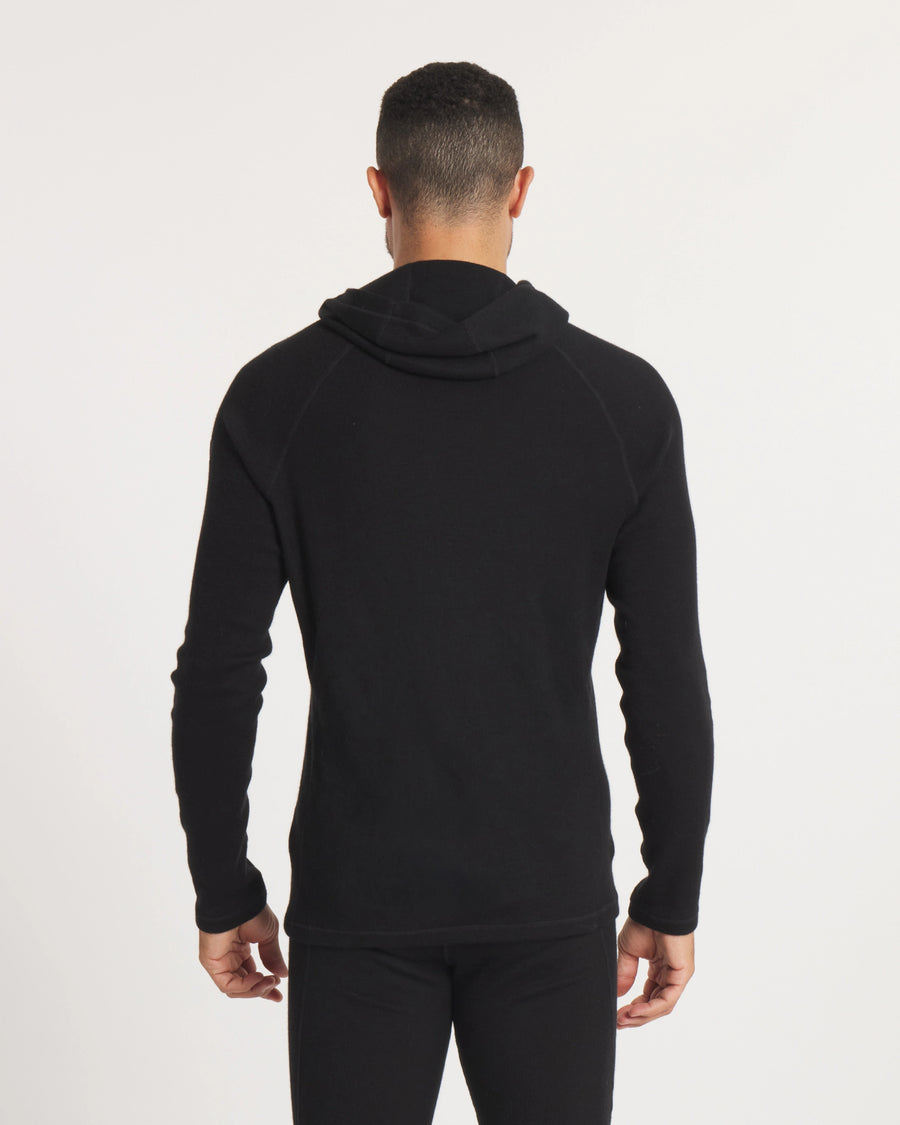 Back view of Men’s Thermal Hoodie in black showing slim fit, raglan sleeves, ergonomic hood folded down on white background